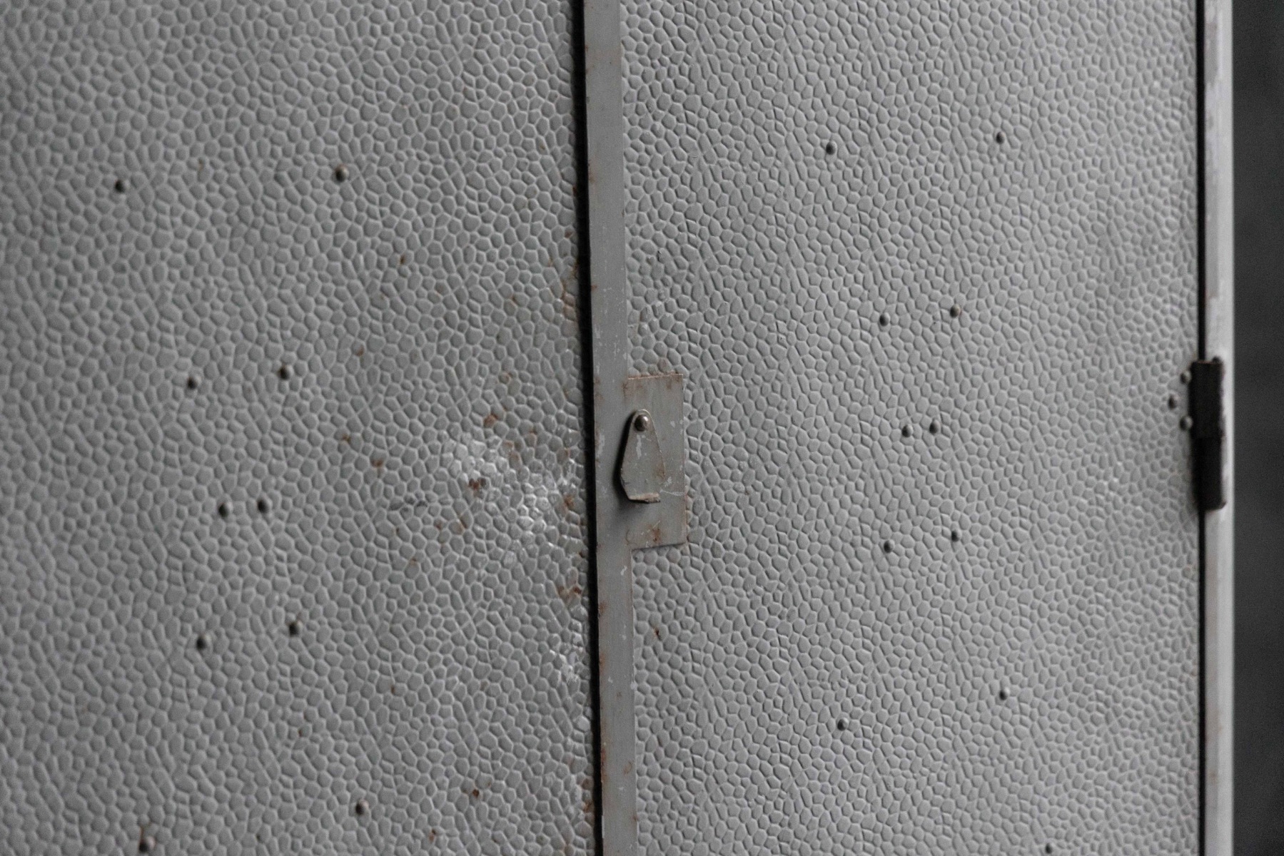 Vintage industrial steel storage cabinet with functional form