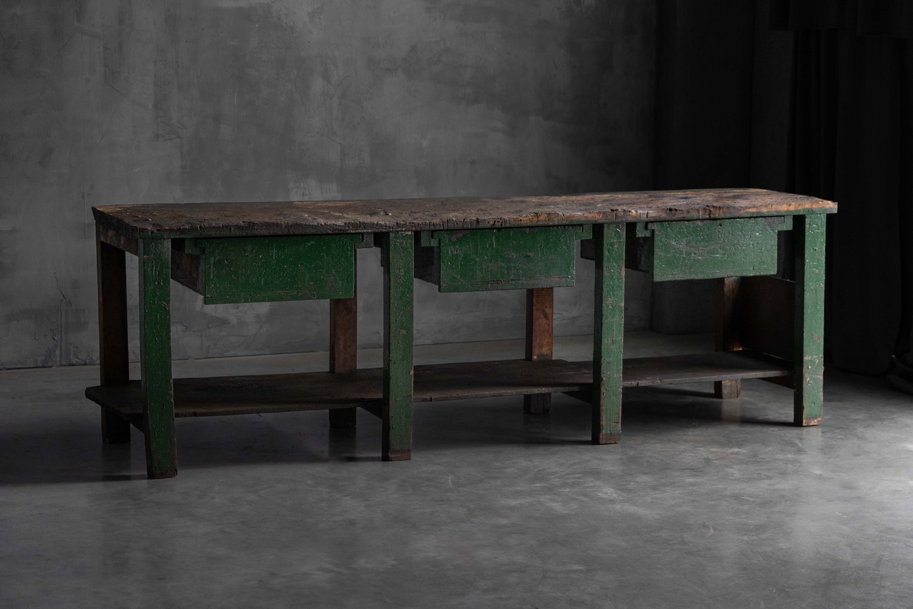 Vintage industrial wooden workbench with timeworn surface