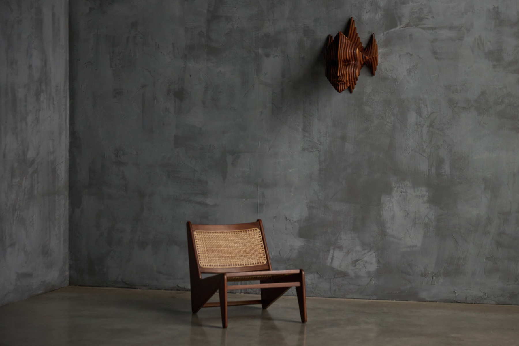 Carved wooden wall panel featuring a sculptural mask, France