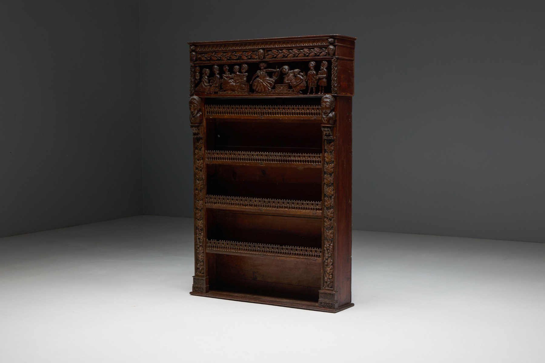Antique French carved open bookcase with sculptural wood decoration, 19th century
