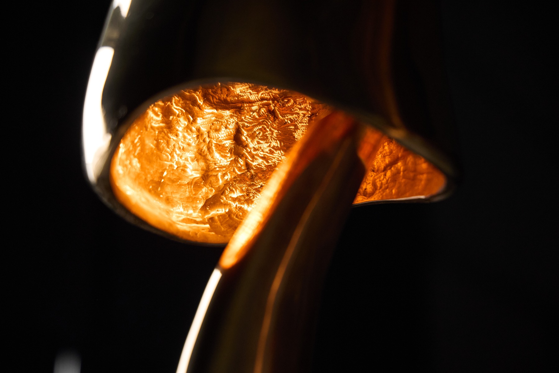 Sculptural bronze light artwork by Carlo Lorenzetti