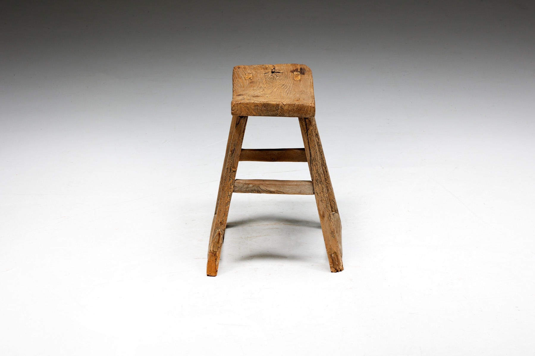 Early twentieth century rustic stool in wood