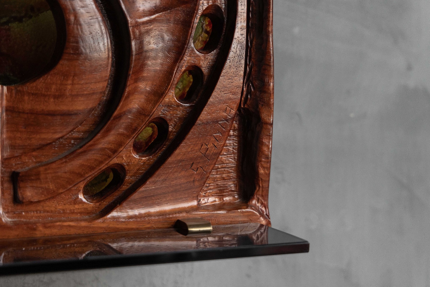 Sculptural wooden wall art by Gianni Pinna, featuring rhythmic carved motifs 