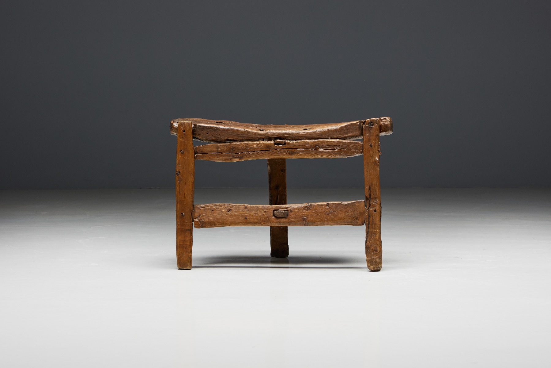 Hand carved tripod bench in solid wood