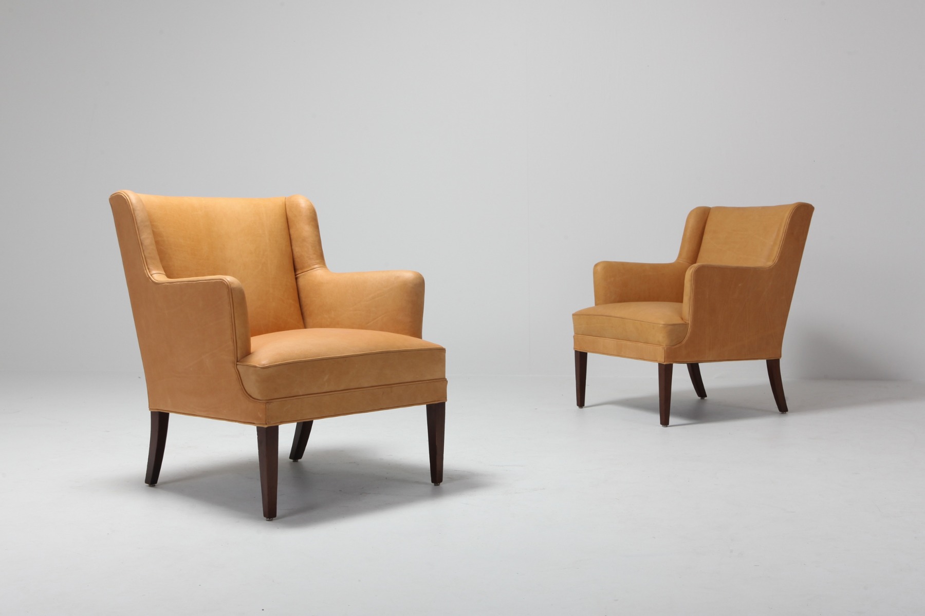 Mid century modern bergere chairs in camel leather