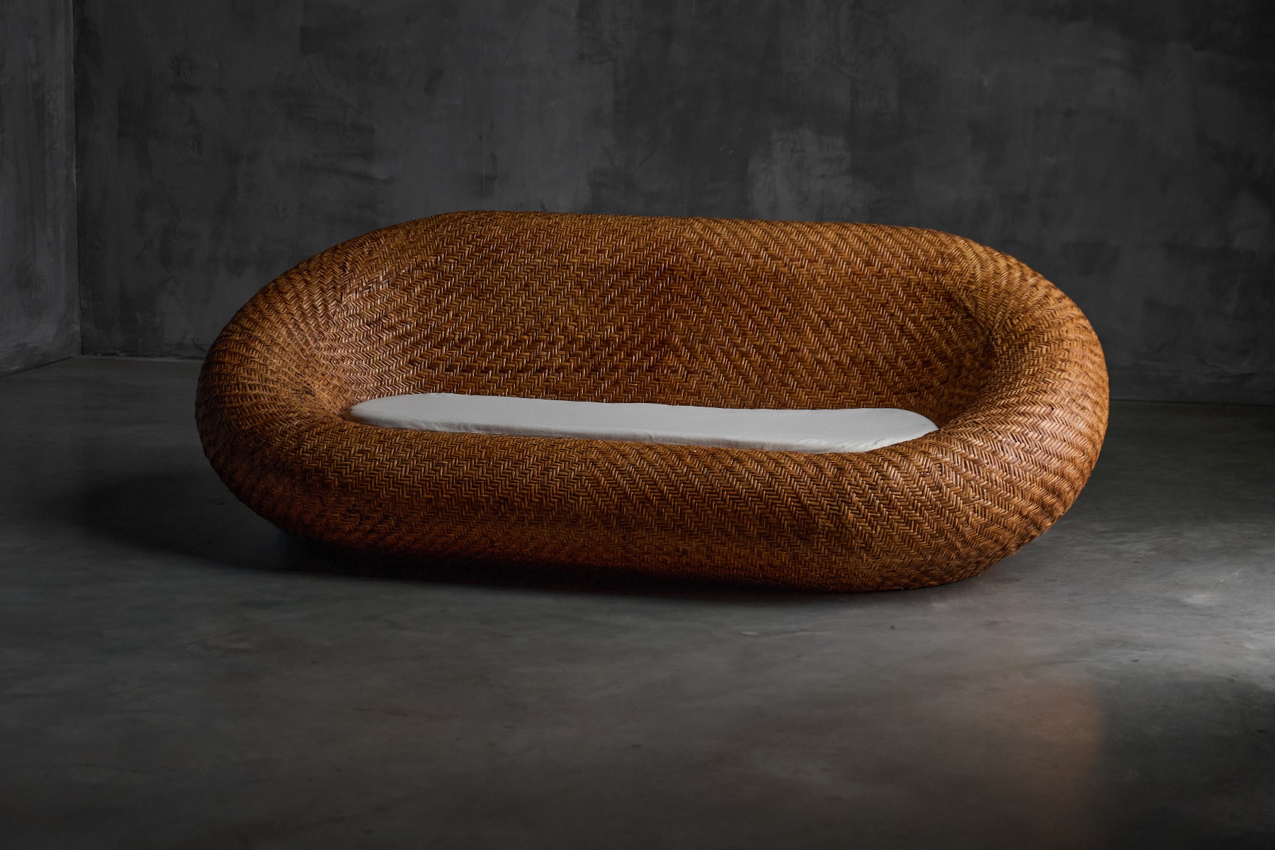 Mid century modern sofa crafted in woven wicker