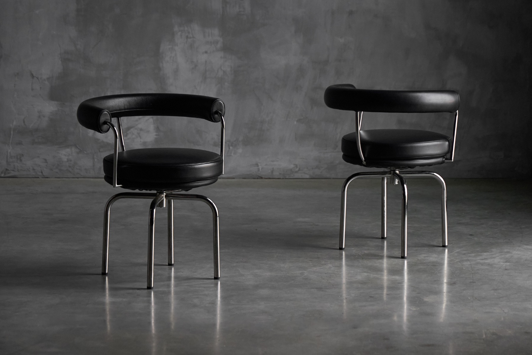 LC7 dining chairs designed by Charlotte Perriand and collaborators