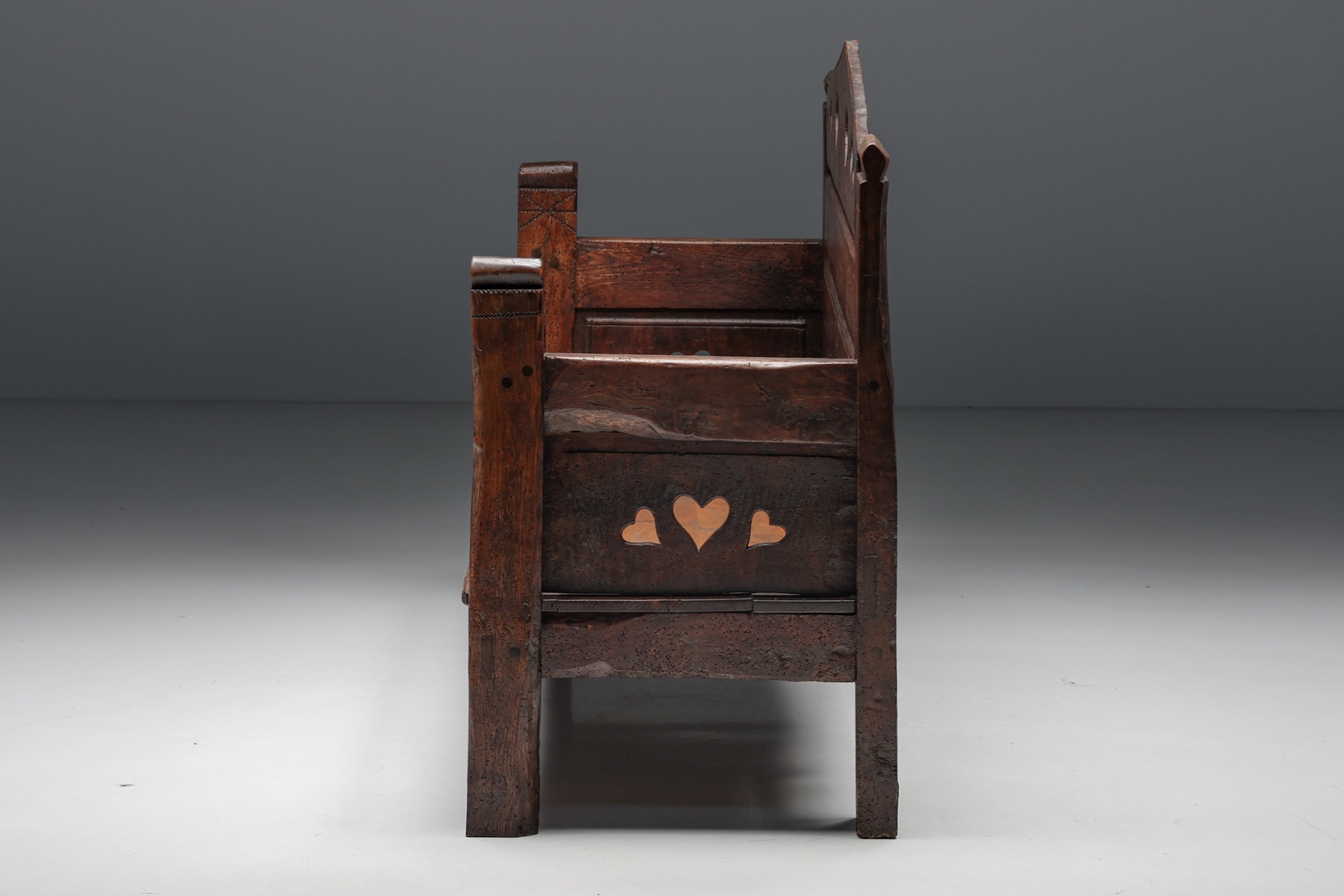 Nineteenth century carved bench with storage in wood