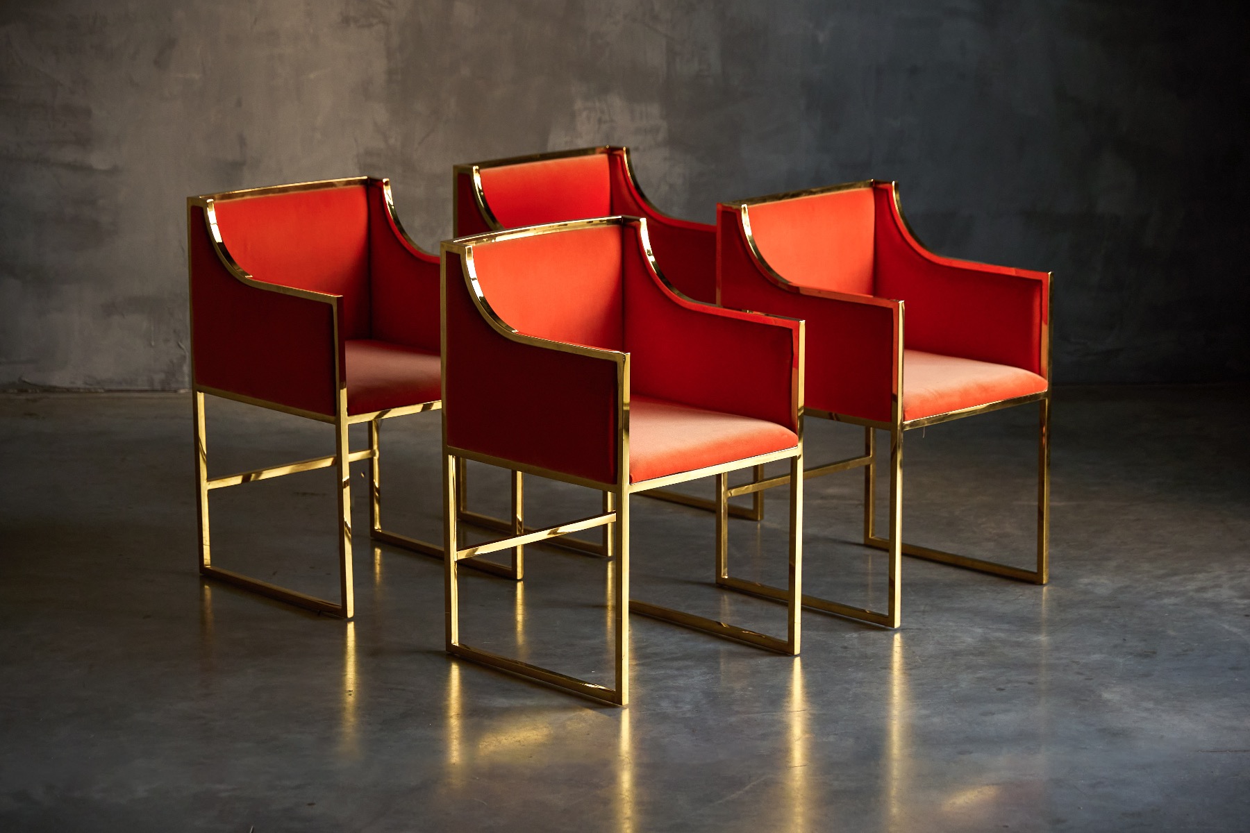 Hollywood Regency style dining armchairs in brass and velvet