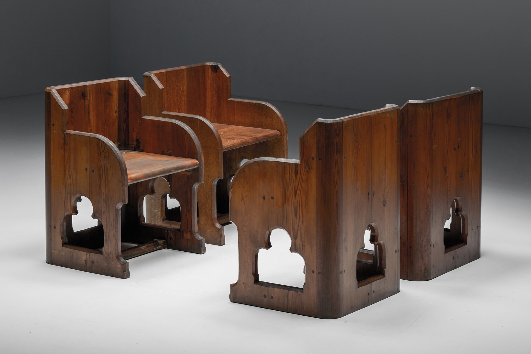 Ornate gothic revival armchairs in carved wood