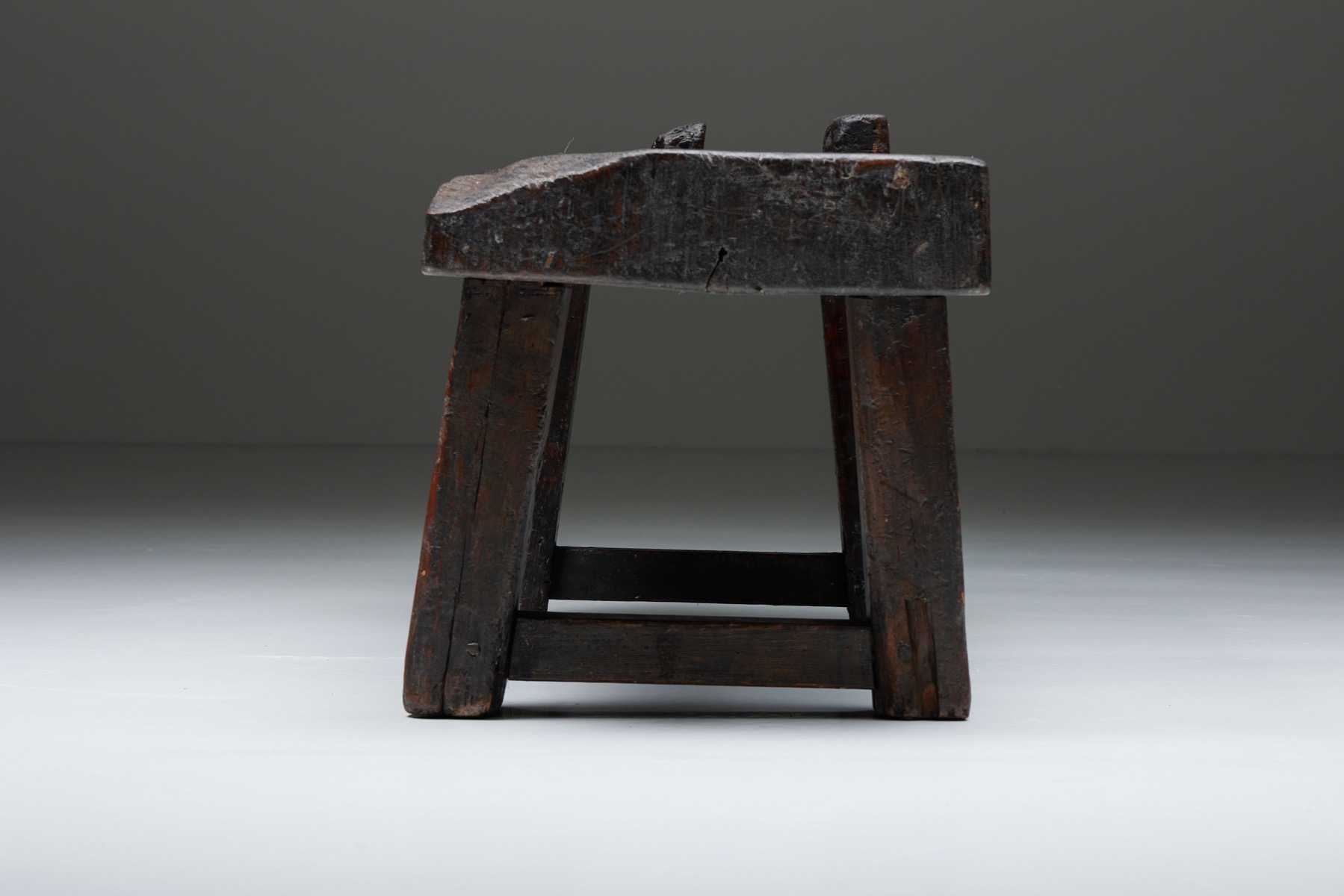 Primitive brown wood bench in wabi sabi design