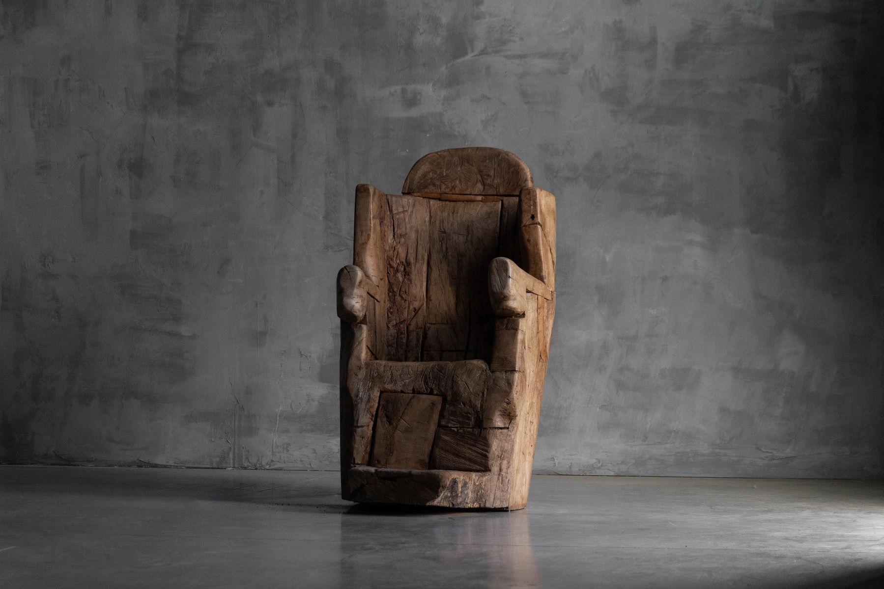 Primitive brutalist throne chair carved in solid wood