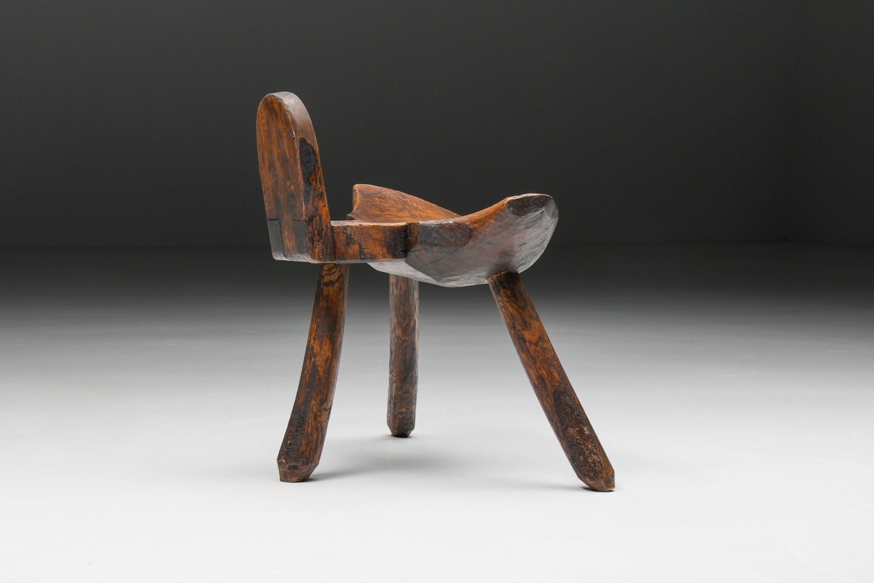 Primitive tripod stool in wabi sabi style