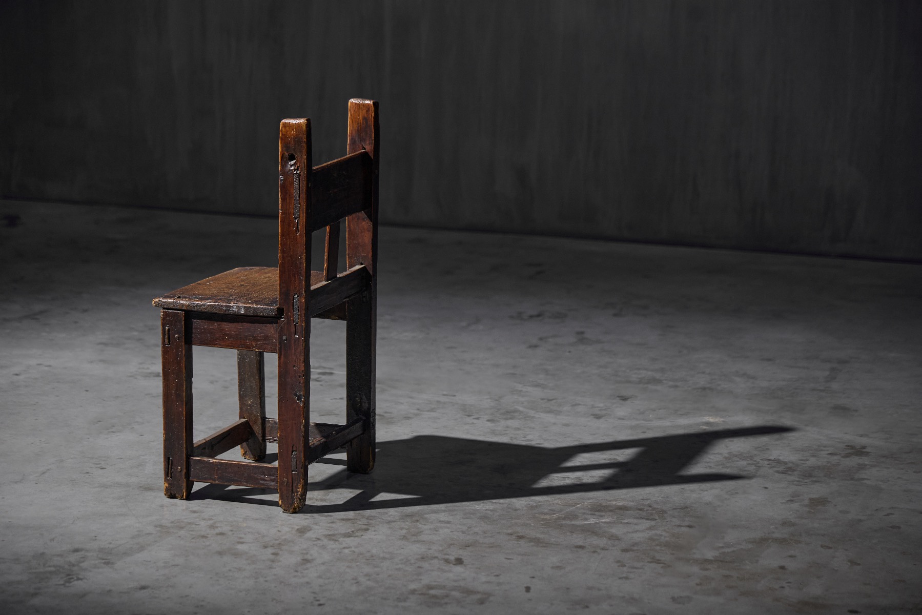 Primitive handcrafted wooden chair for a child