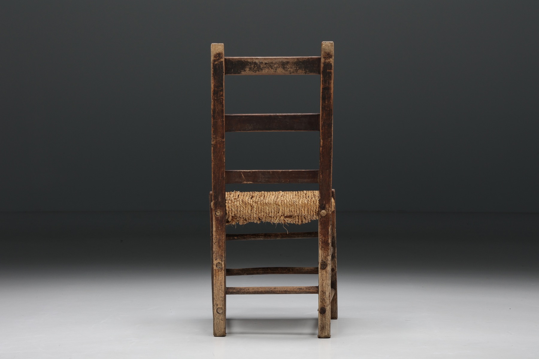 Retro rattan chair in artisanal style with wood frame