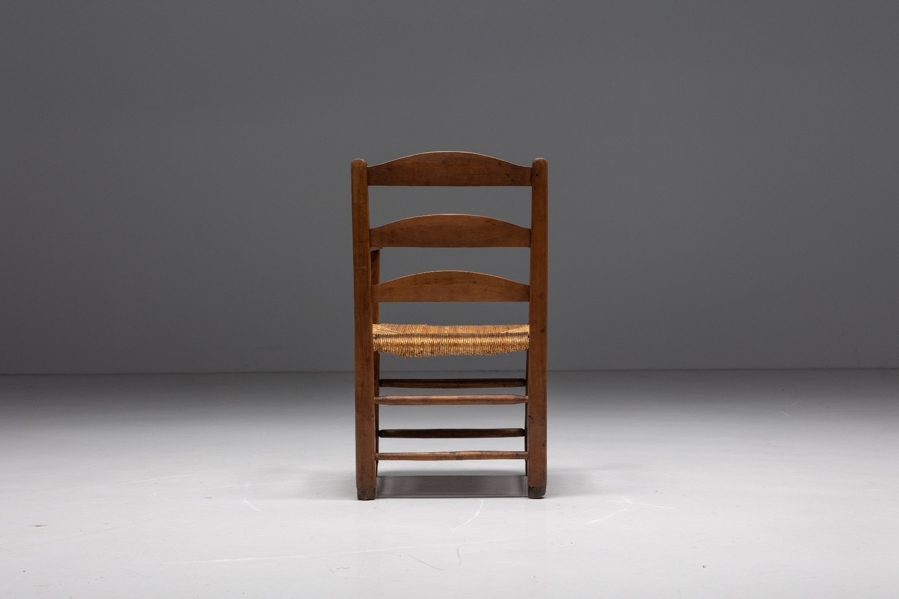 Rustic armchair with wood frame and cord weaving