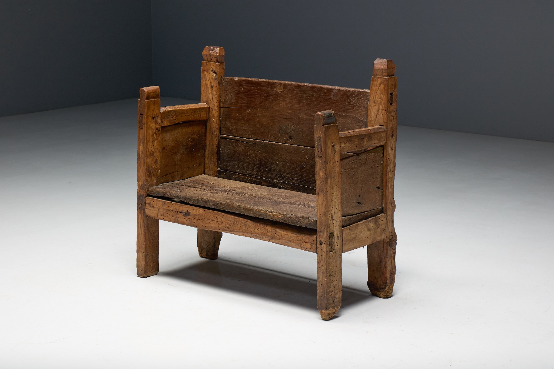 Rustic primitive bench reflecting 19th century craftsmanship