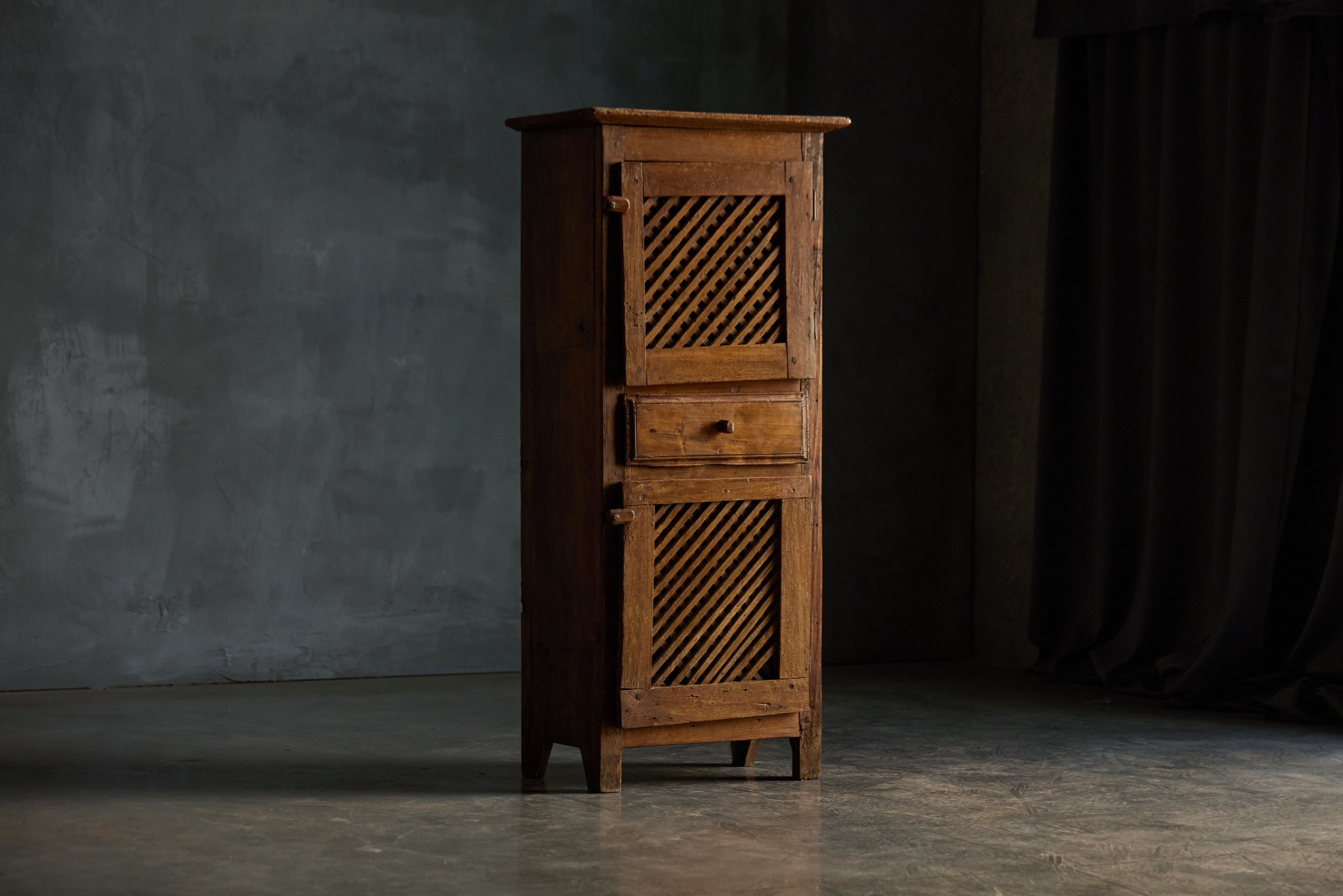 Vernacular rustic cabinet with folk art detailing