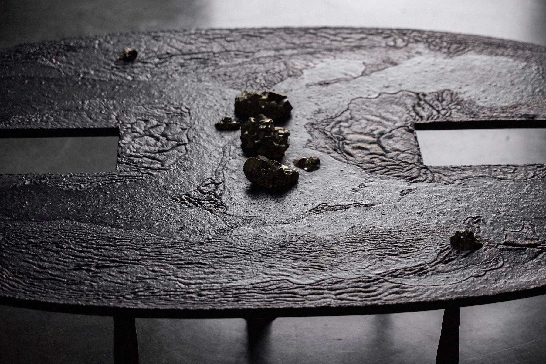 Contemporary iron coffee table with mineral inclusions designed by Thomas Serruys