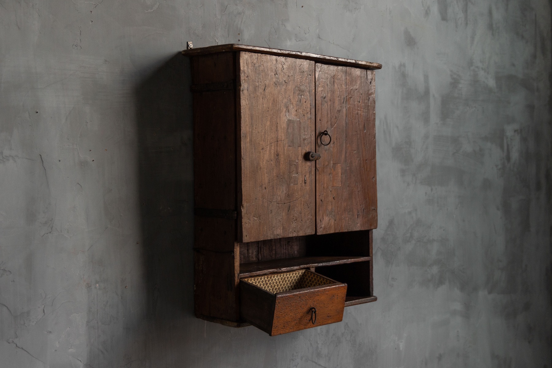 Country wall cabinet reflecting vernacular craftsmanship