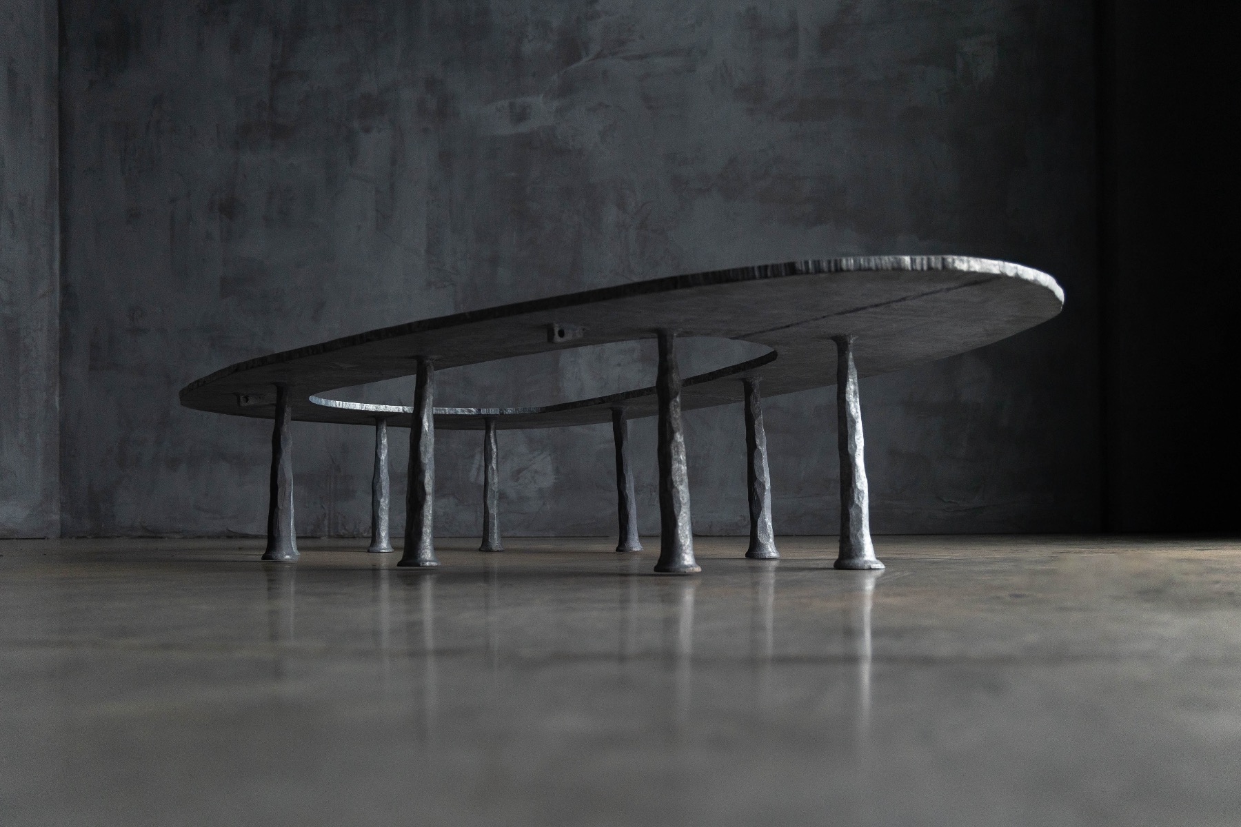 Refined elliptical living room table by Serruys