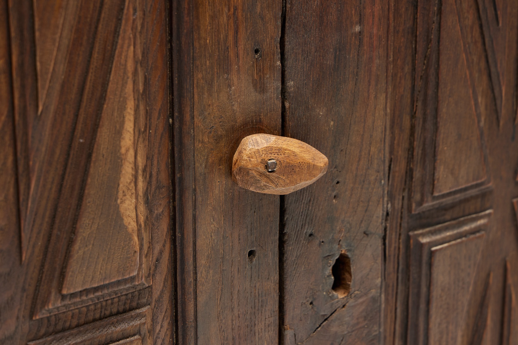 Handcrafted folk art cupboard in rural style