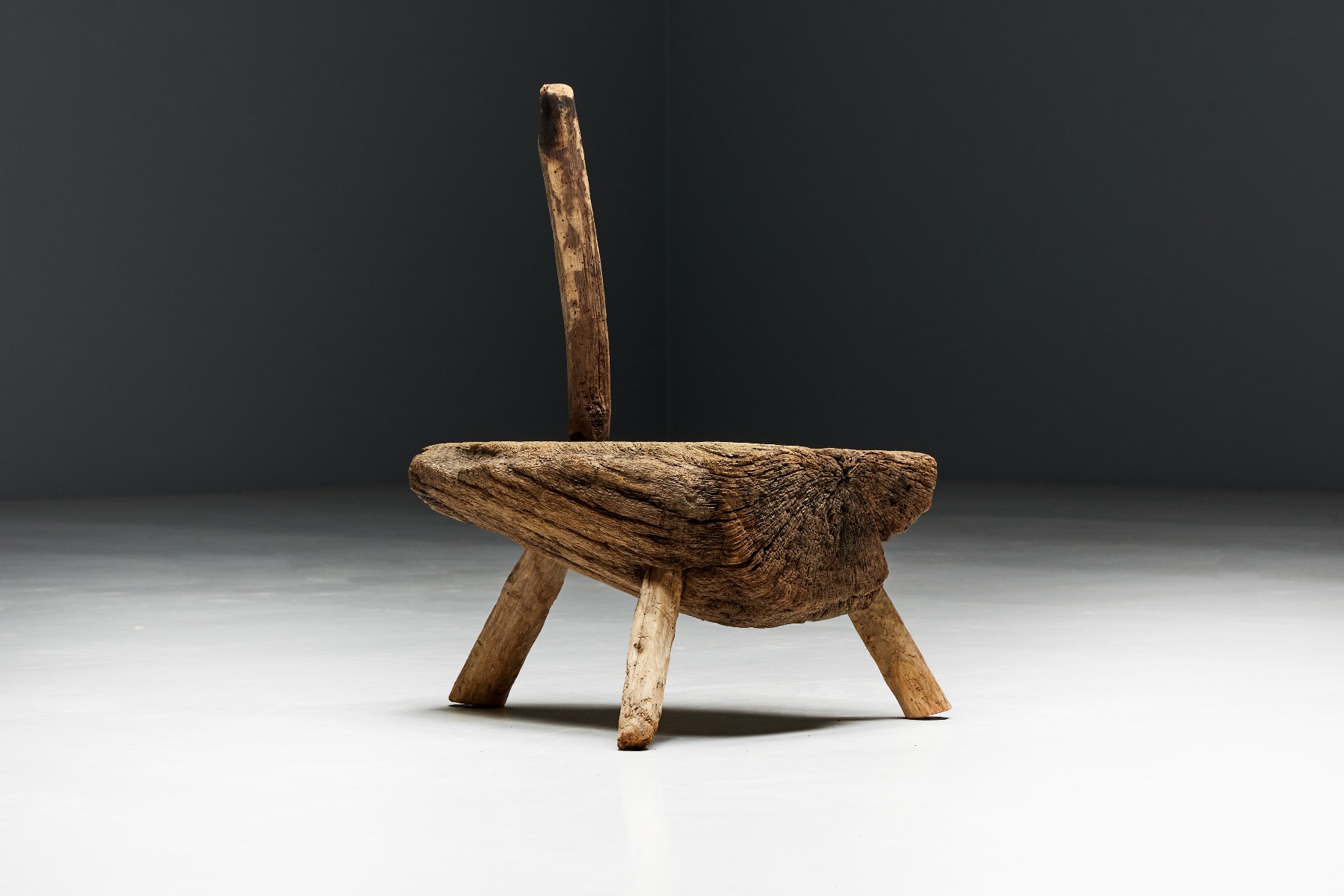 Handcrafted folk art tripod chair in monoxylite