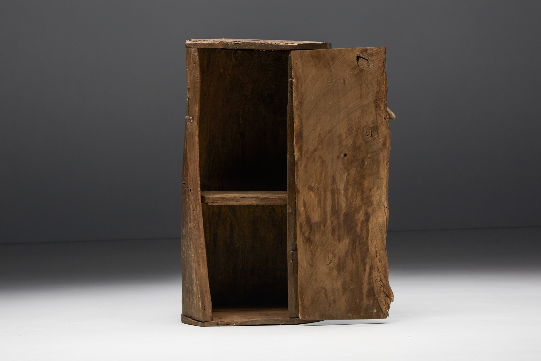 Handcrafted monoxylite cabinet in solid form