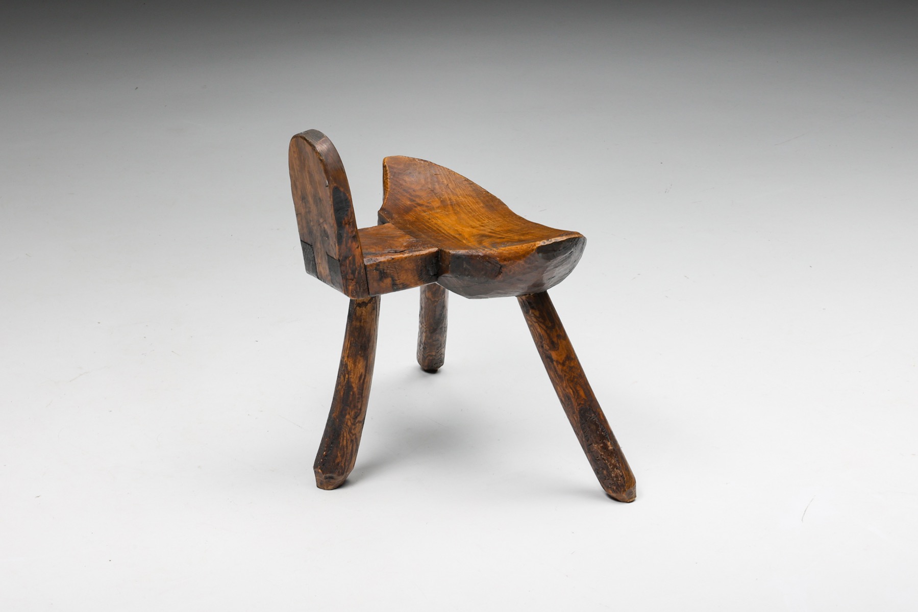 Handcrafted wabi sabi tripod stool in solid wood