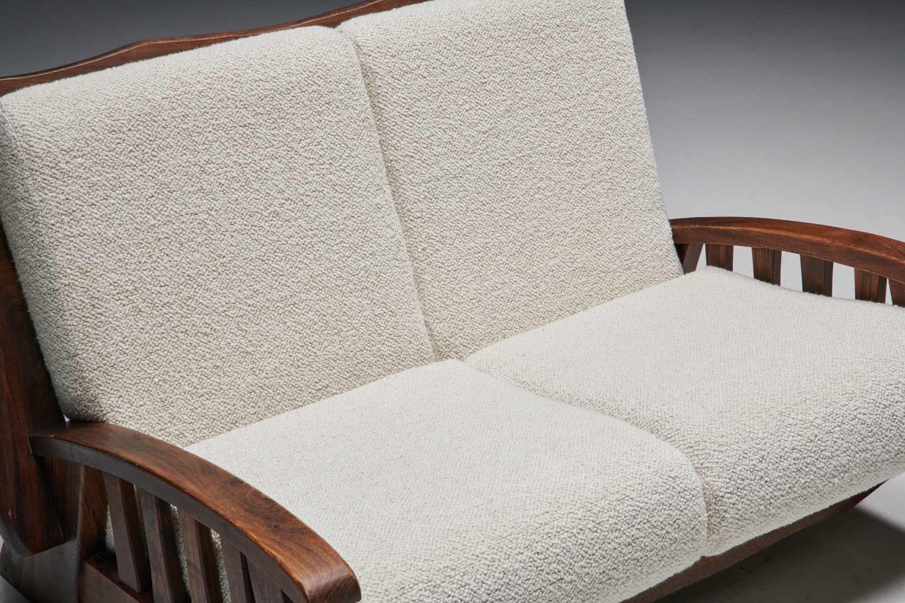 Mid century chalet sofa in boucle and walnut from the 1960s