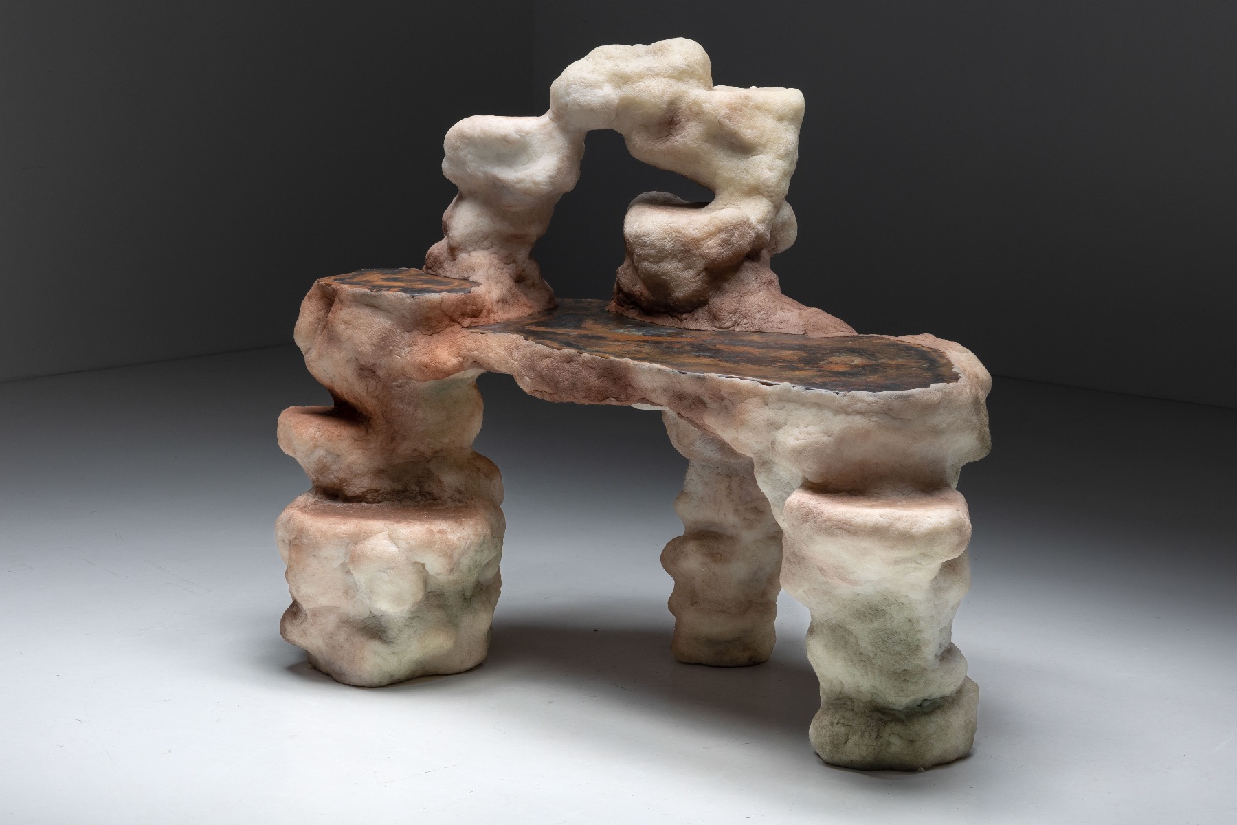 Modern lithic desk and chair with sculptural design