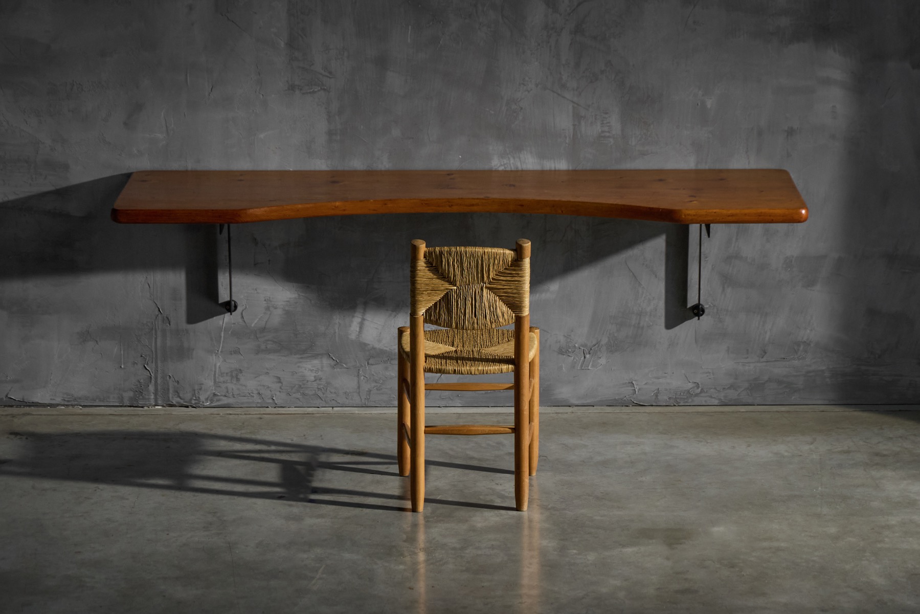 Modernist wall mounted desk with wood top by Charlotte Perriand
