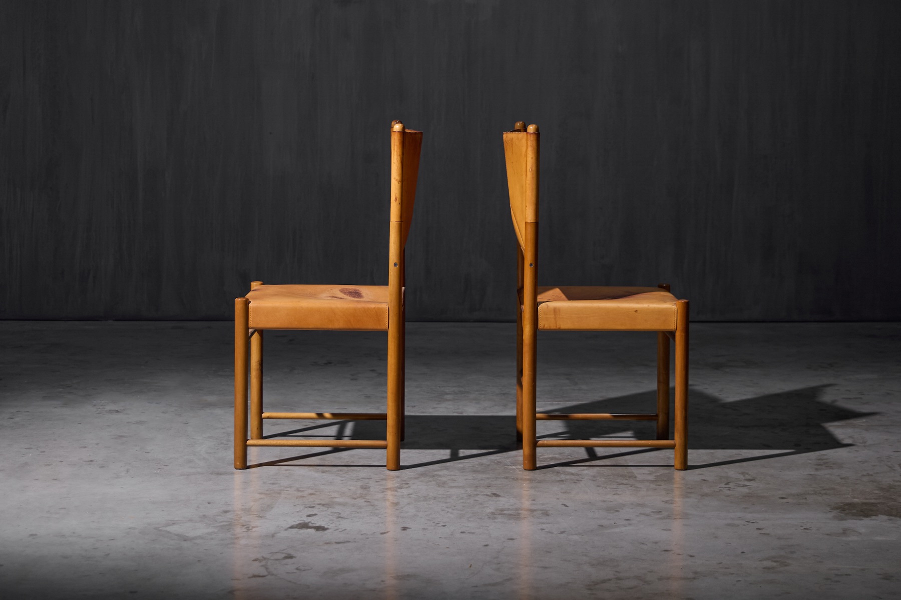 Retro leather dining chairs with warm brown tone
