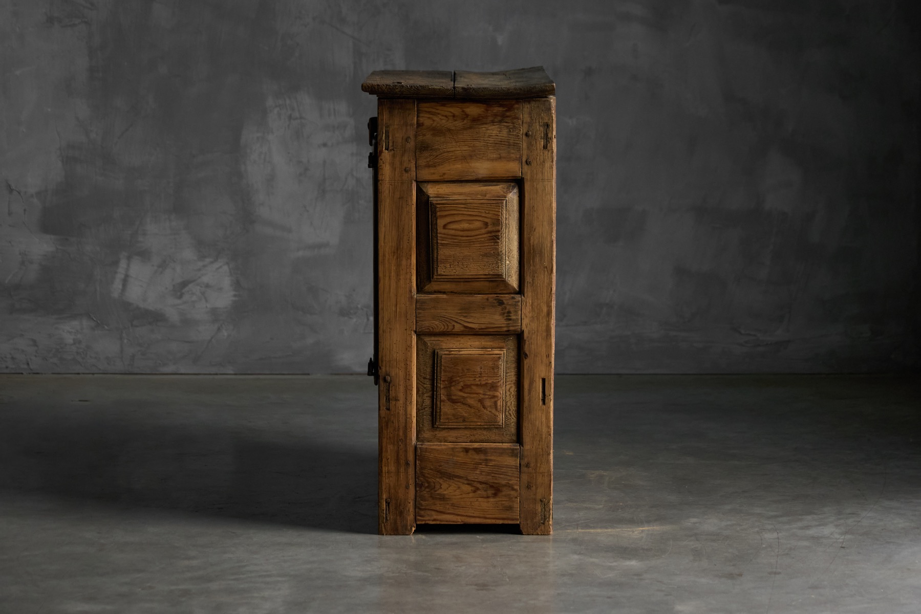 Rustic rural pantry cabinet reflecting folk craftsmanship
