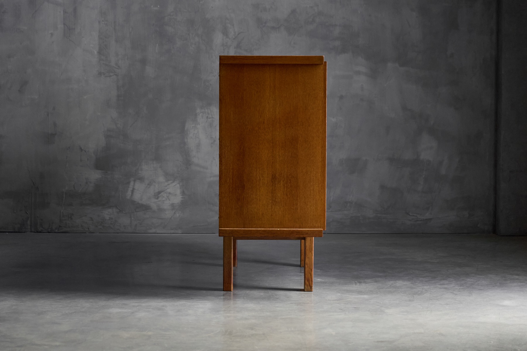 Sculptural brutalist cabinet executed in oak