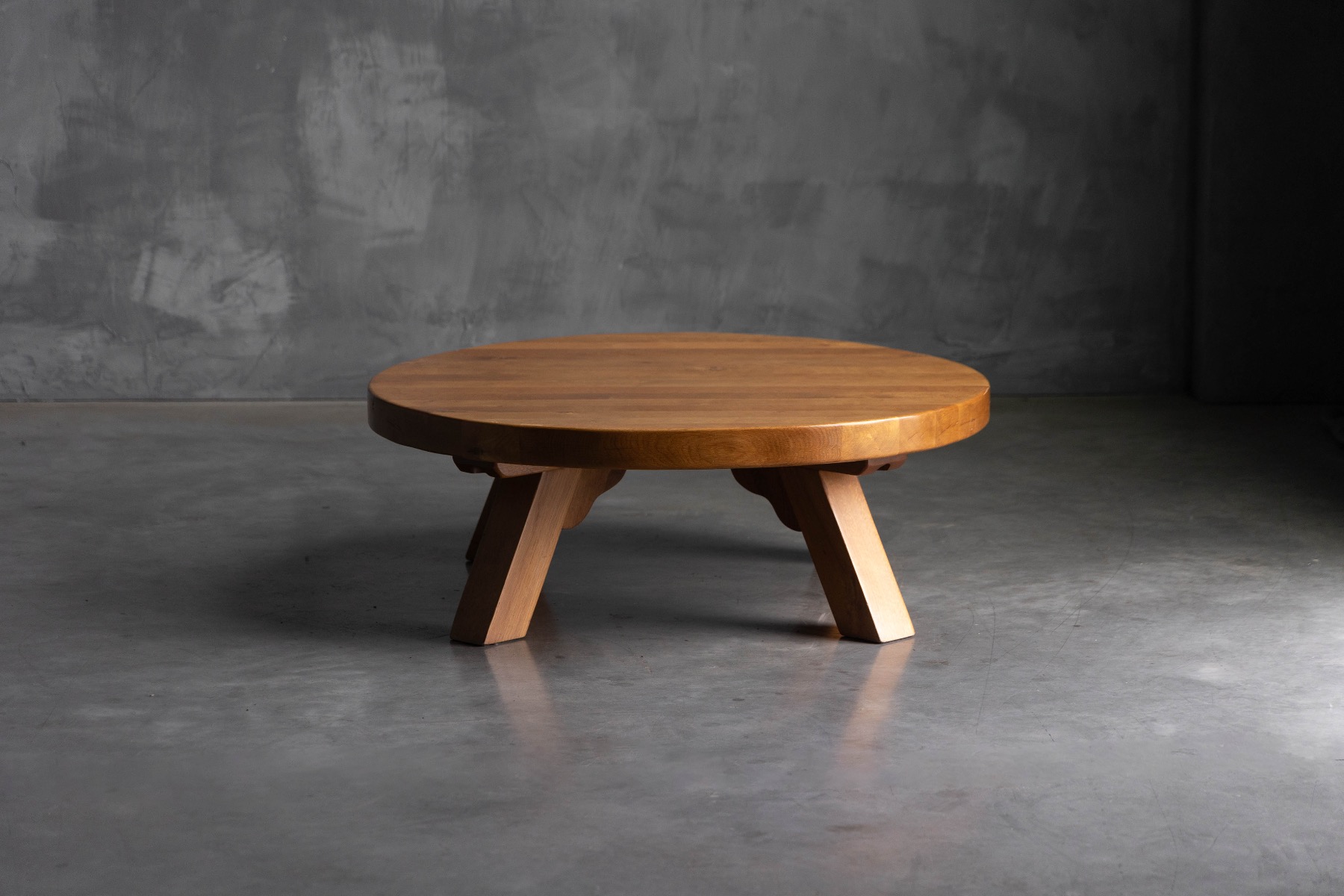 Sculptural brutalist round coffee table with solid oak presence