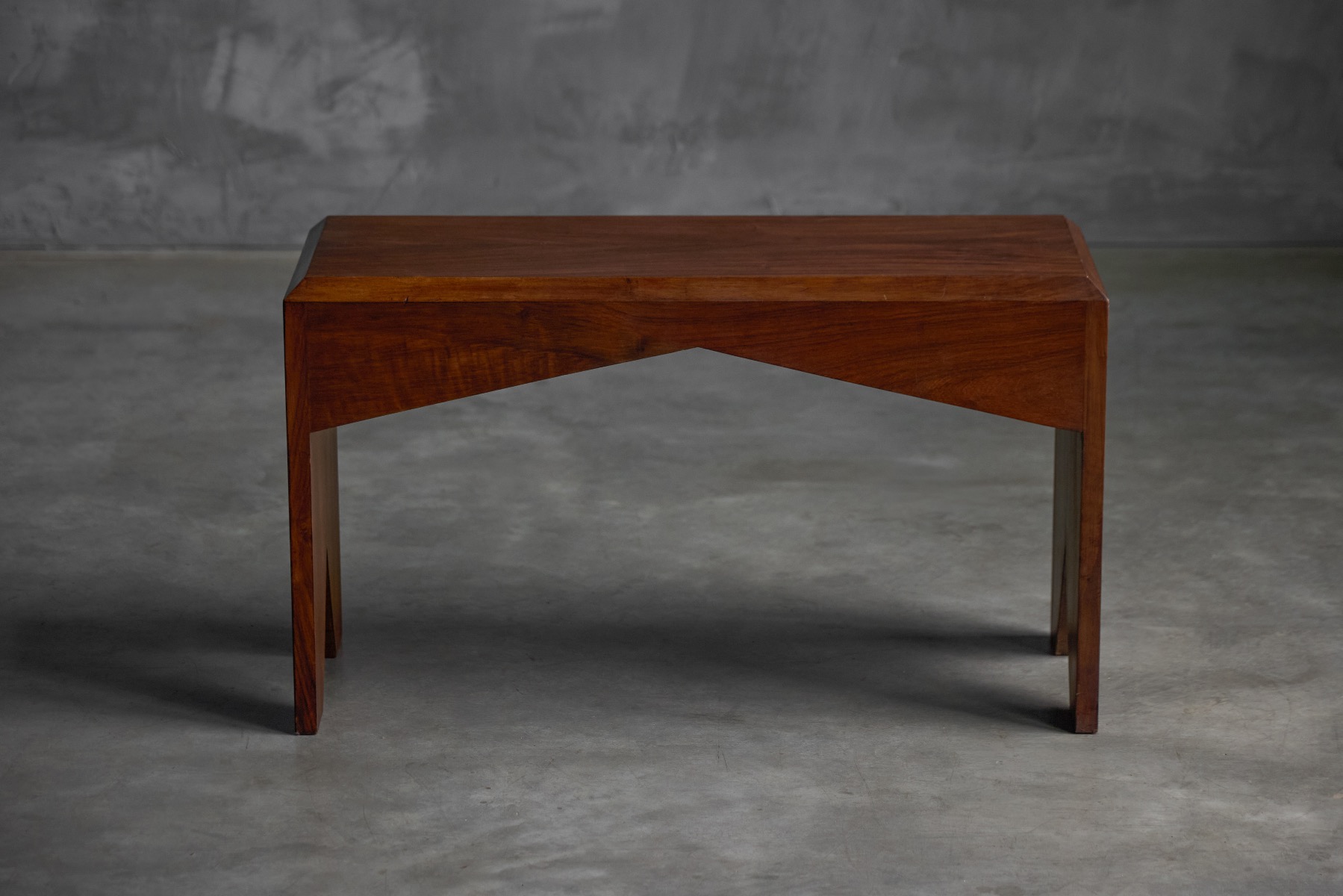 Sculptural mid century walnut bench with warm wood tone