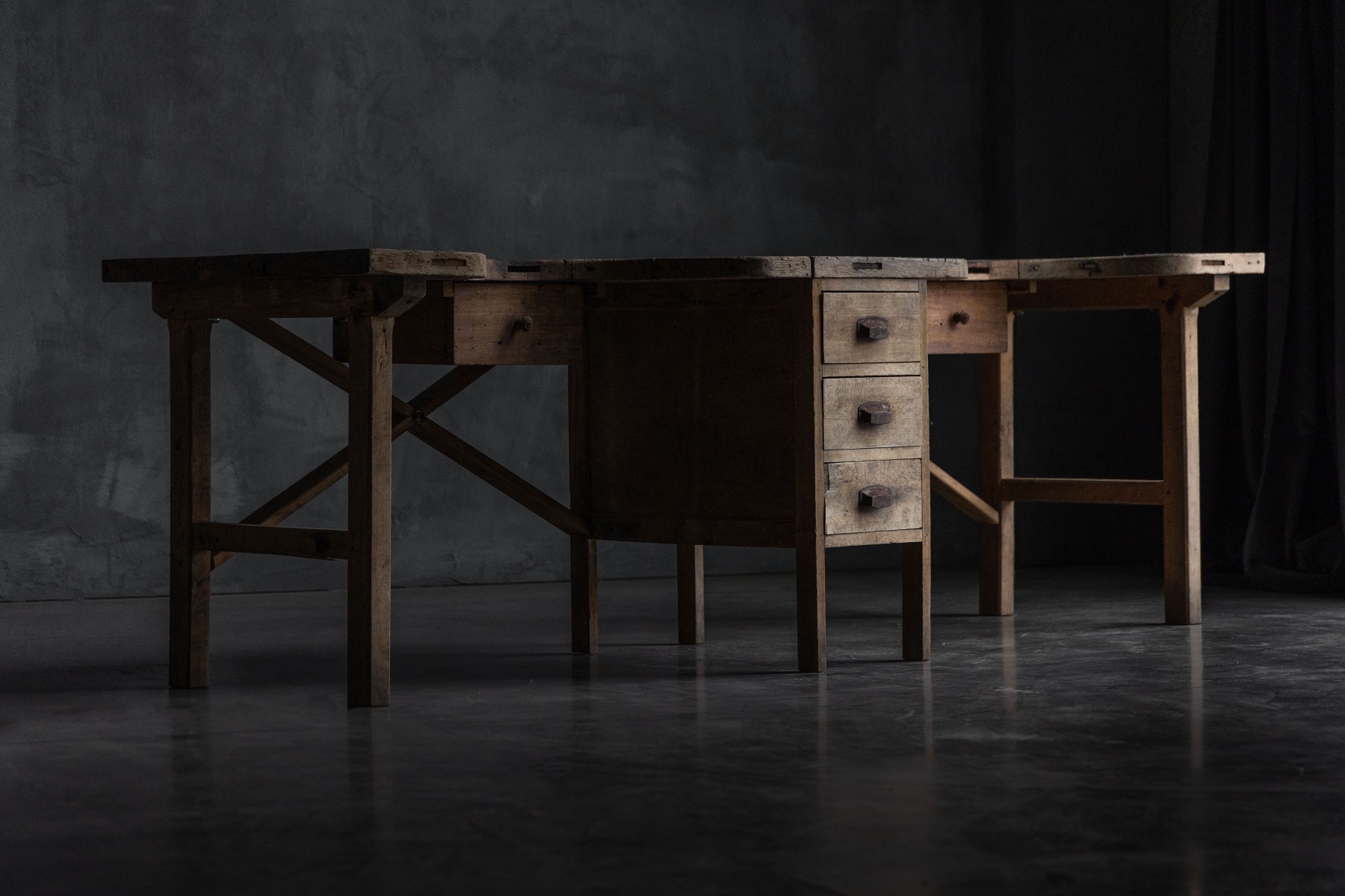 Timeworn rustic jeweller’s workbench with storage details