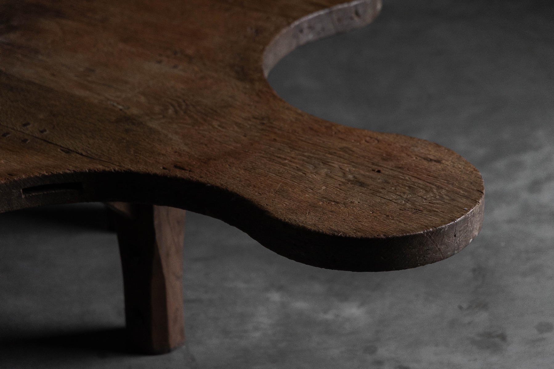 Timeworn coffee table with expressive carved structure