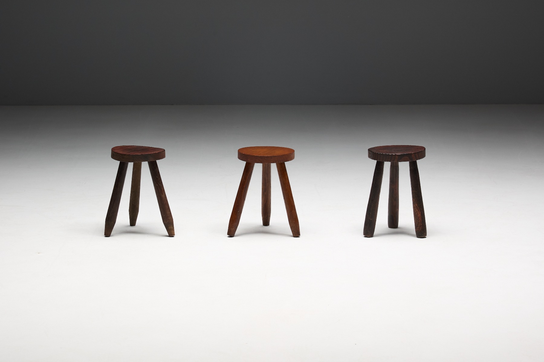 Solid wood brutalist tripod stool with raw texture