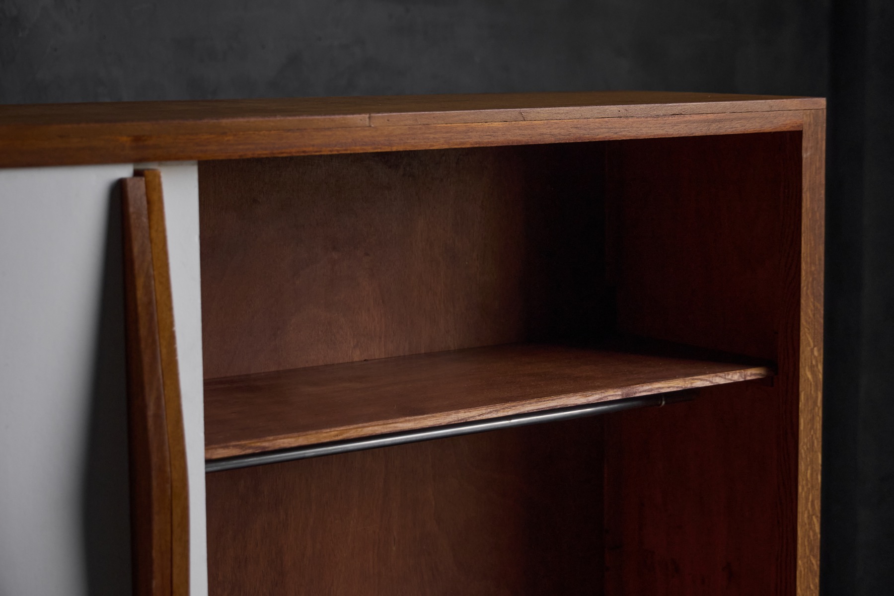 Architectural wood storage cabinet with sliding doors by Perriand and Prouvé  