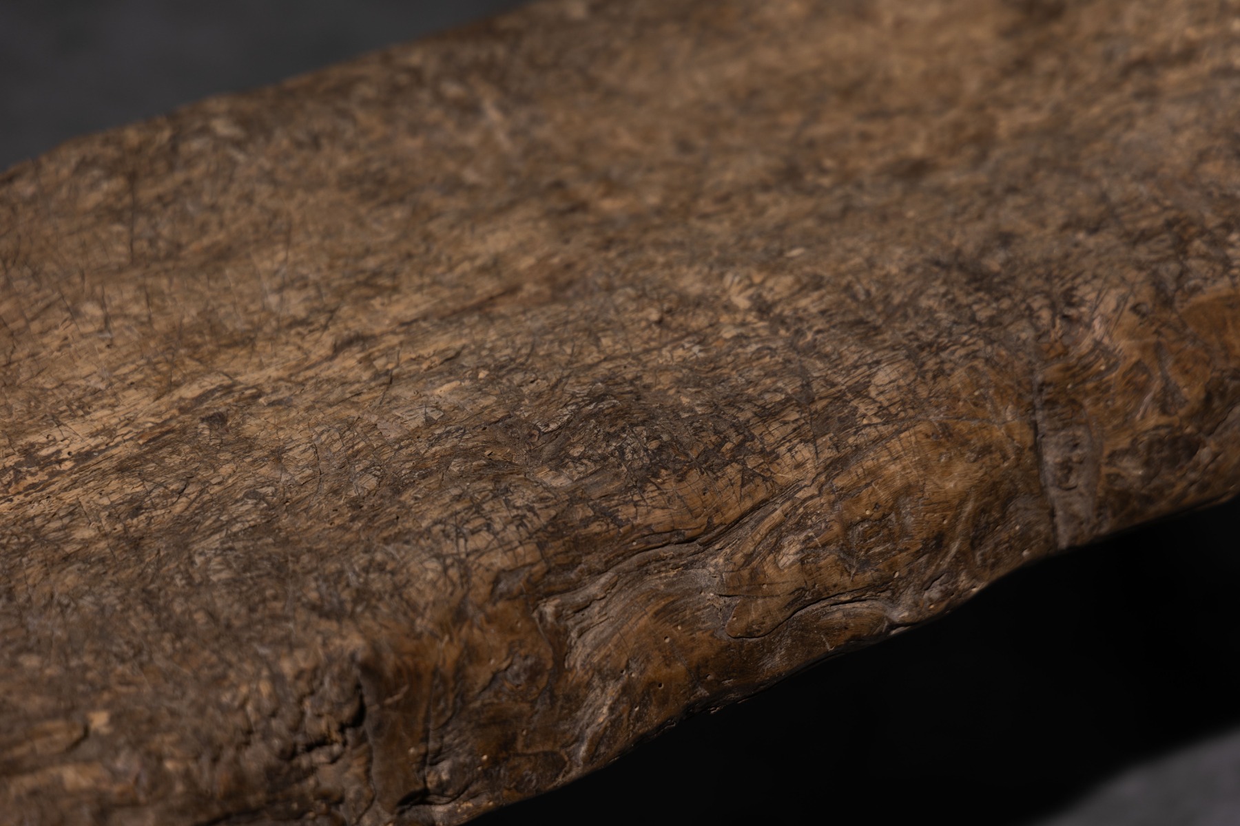 Timeworn rustic bench featuring carved details