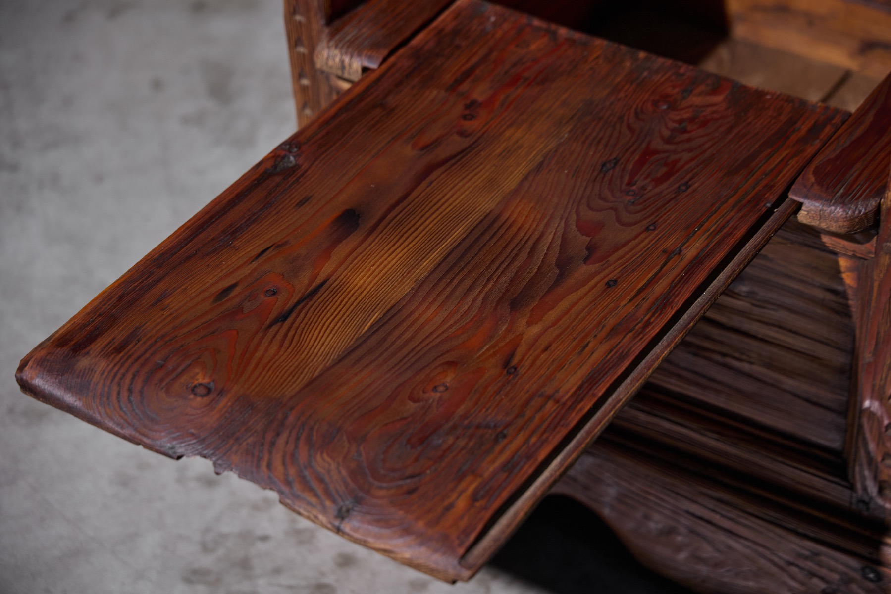 Vernacular wooden armchair with functional inner space