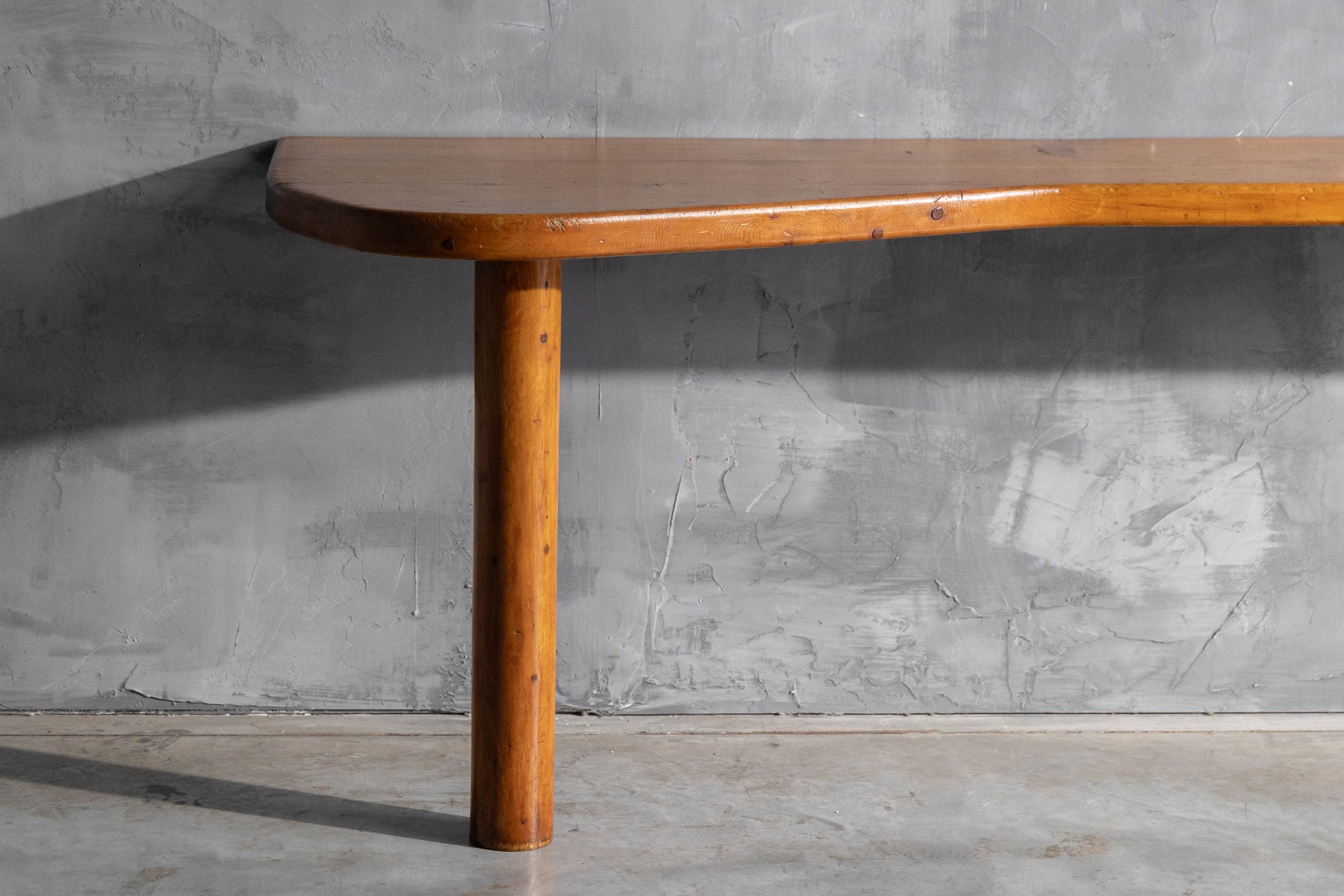 Sculptural wooden console table by Charlotte Perriand