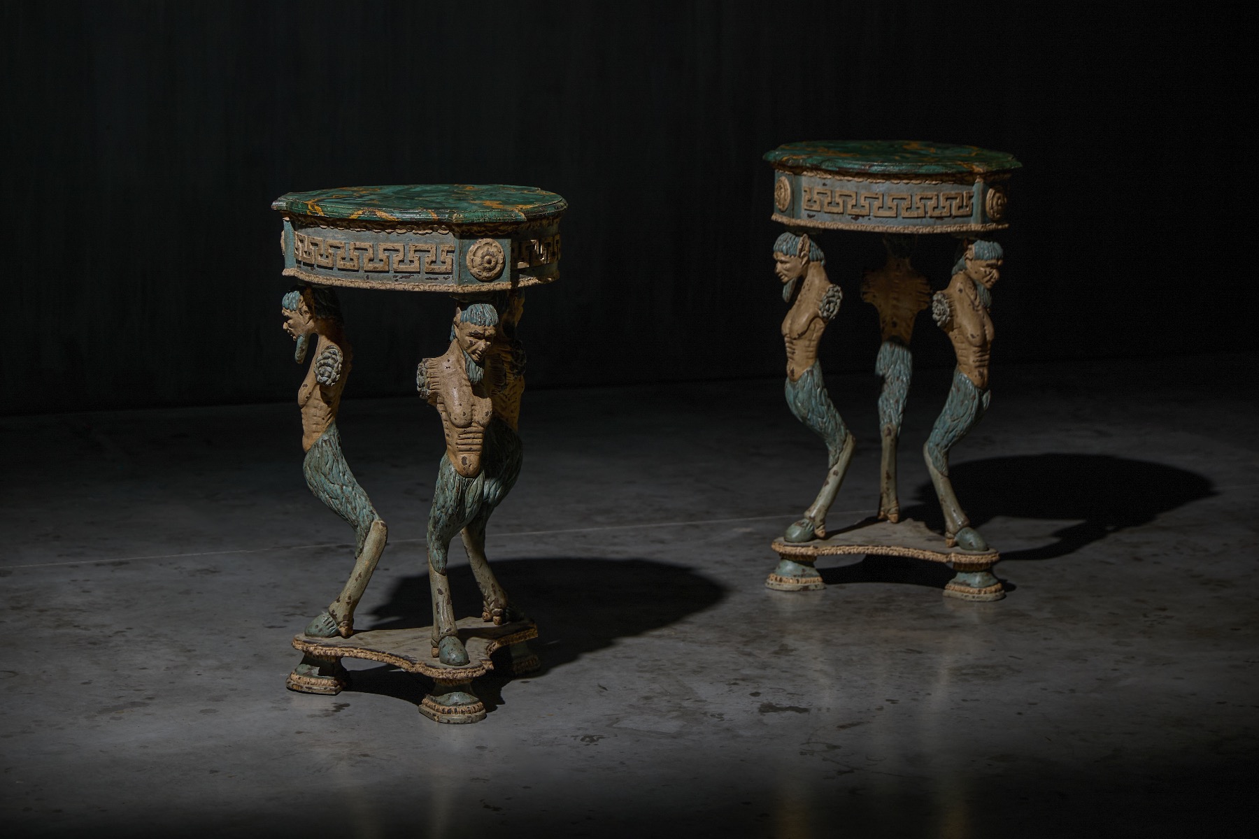 Ornate neoclassical tripod table with sculpted details