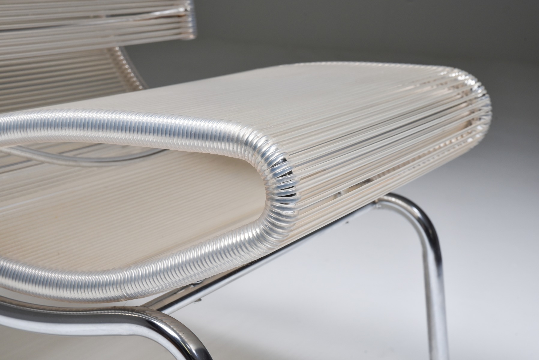 Designer easy chairs in chrome and plastic wire from the 1960s
