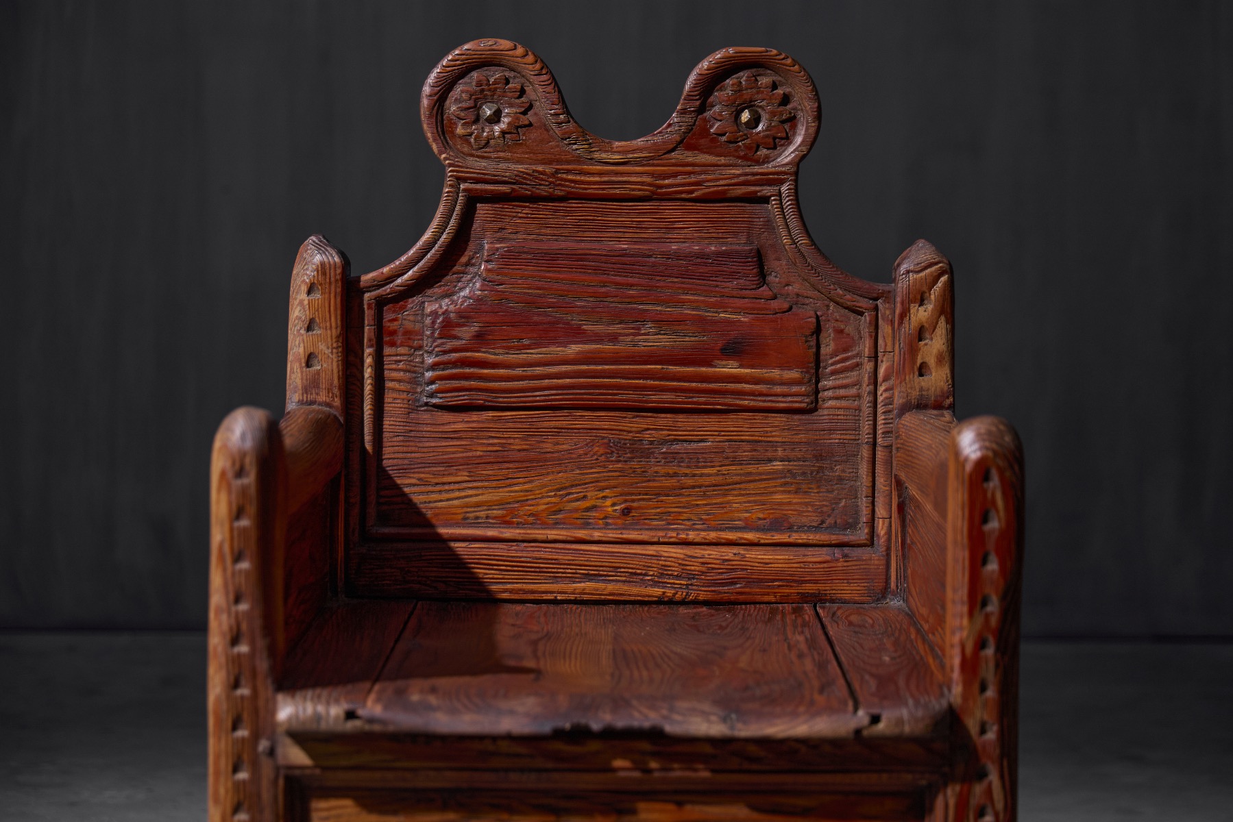 Folk art armchair combining seating and storage