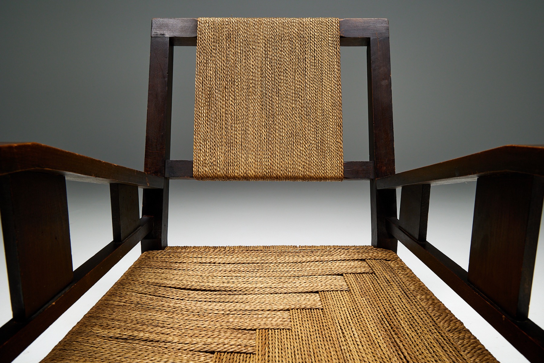 Handcrafted wood chair with rope seat from the 1930s