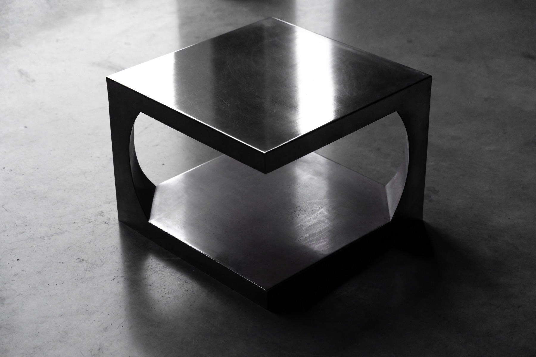 Minimalist aluminum side table dating to the 1970s