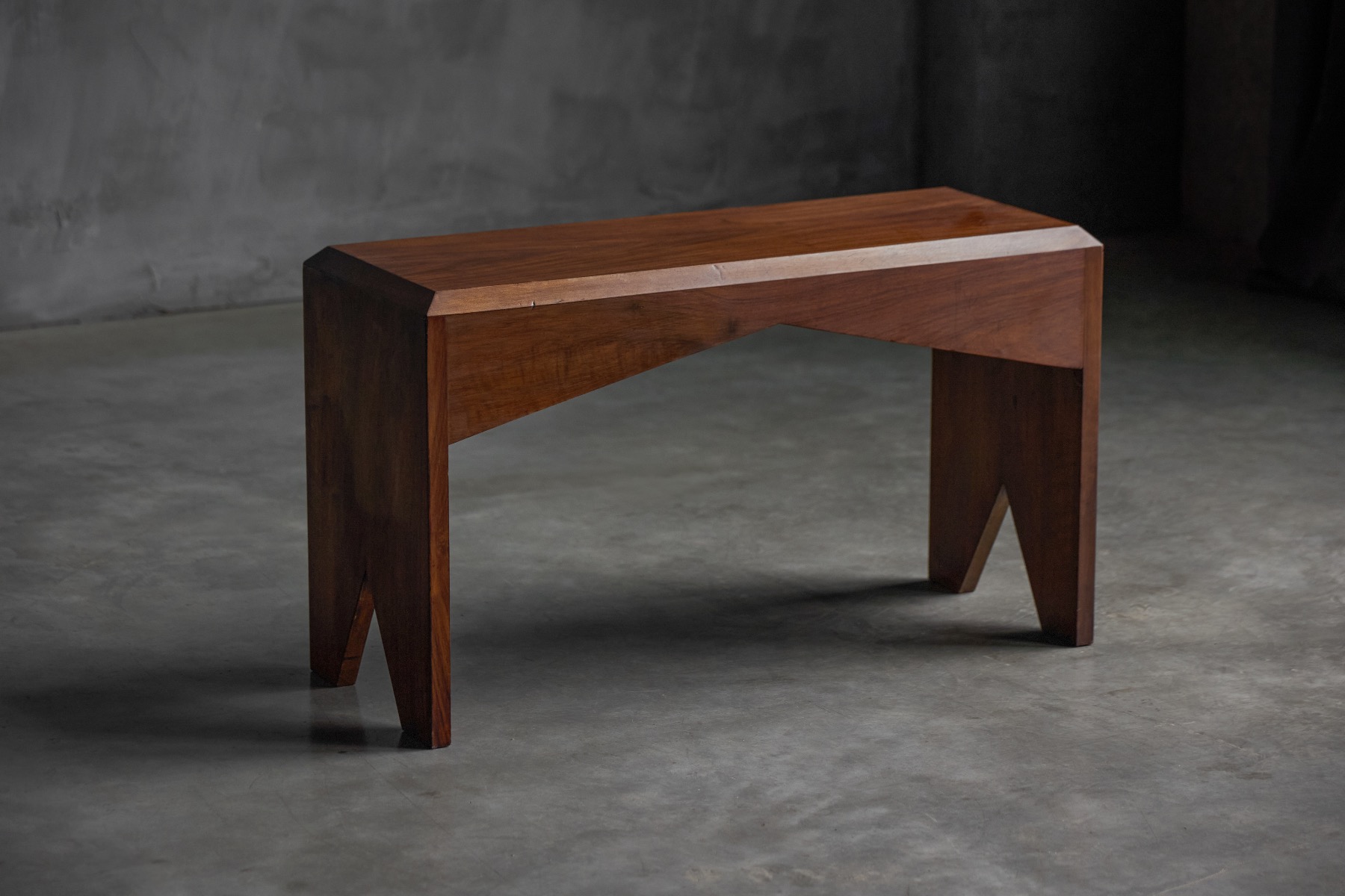 Minimalist walnut bench dating to the late 20th century